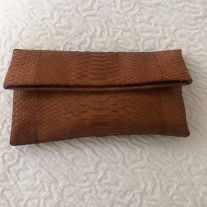 Animal skin clutch